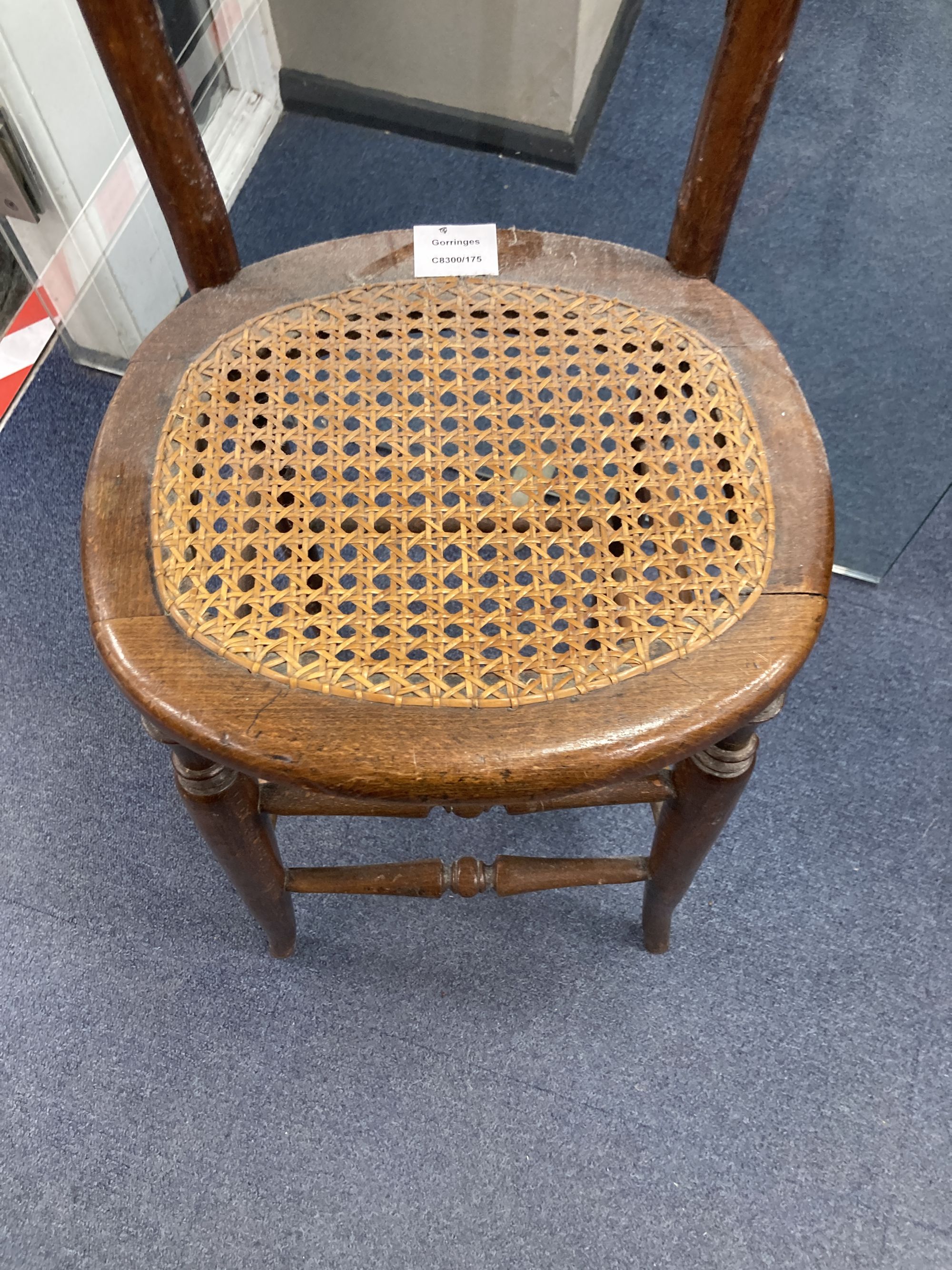 A Victorian beech cane seat correction chair